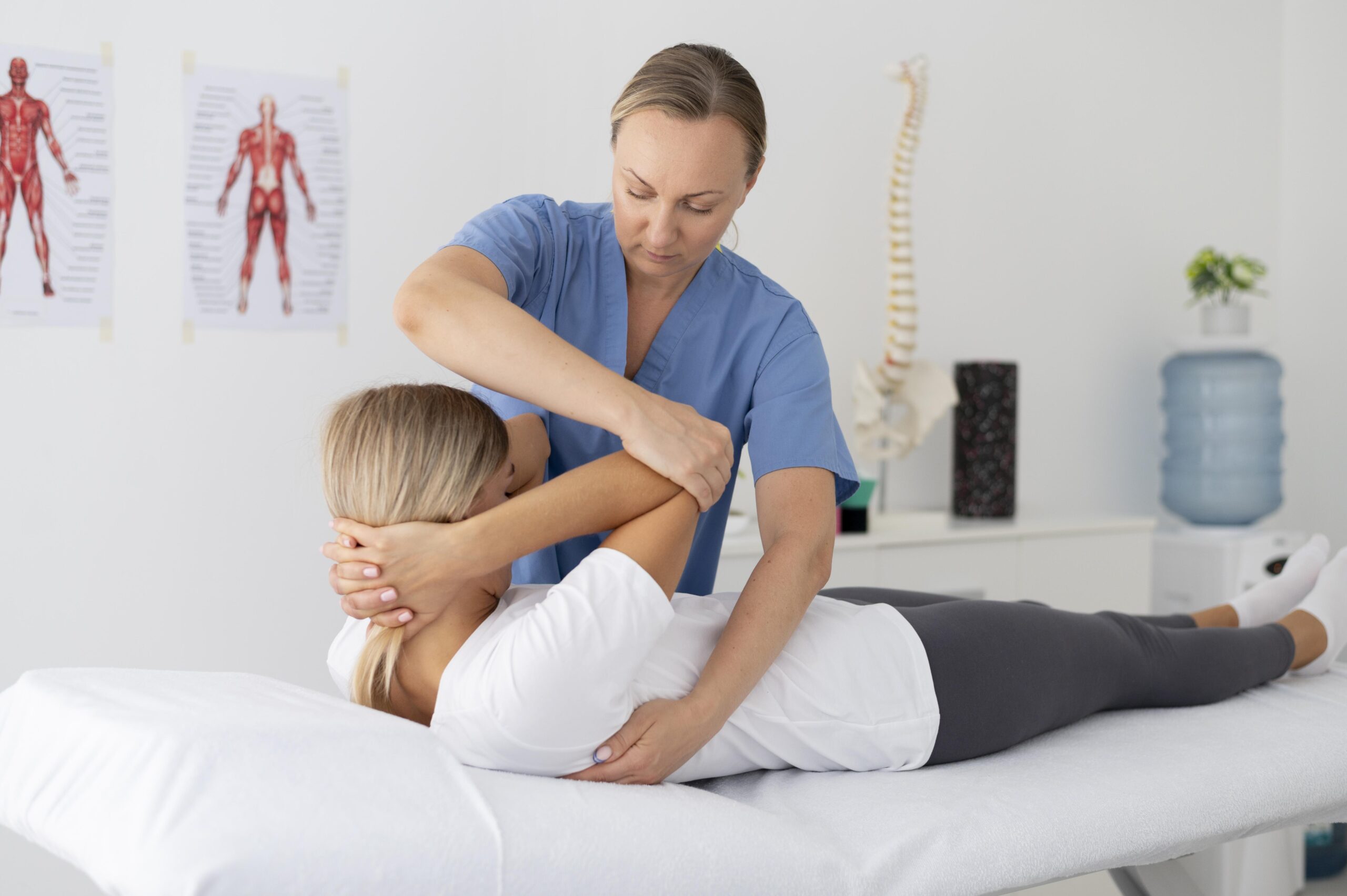 physiotherapist helping young female patient scaled